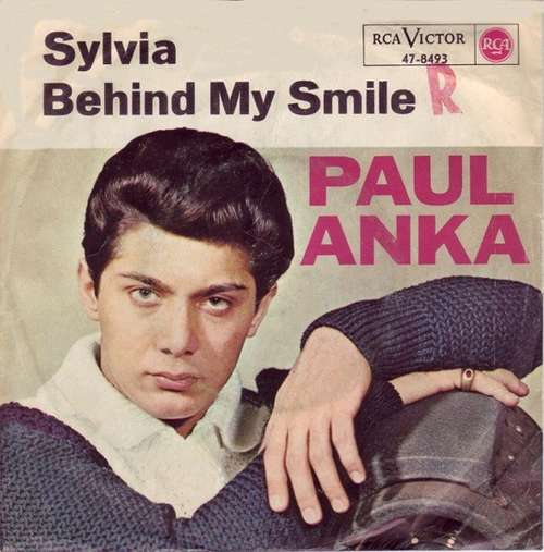 Cover Paul Anka - Sylvia / Behind My Smile (7, Single) Schallplatten Ankauf