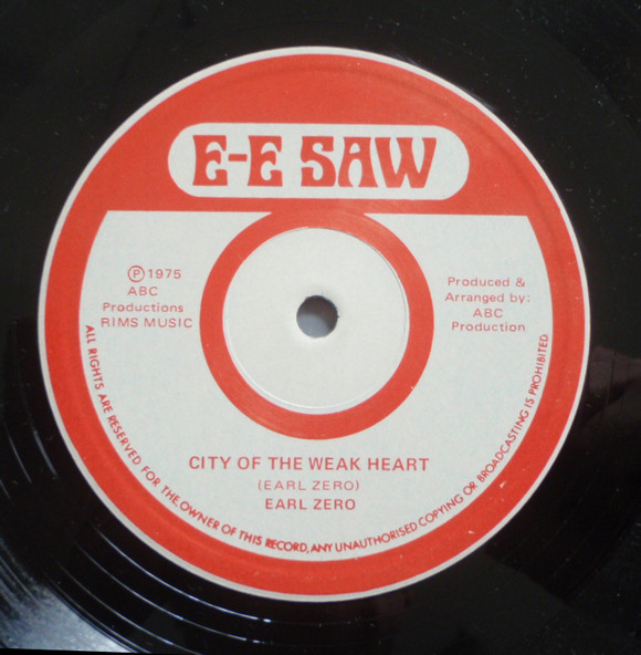 Cover King Tubby & Jacob Miller - E-E Saw Dub (LP) Schallplatten Ankauf
